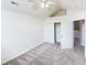 Bright bedroom features a fan and an open closet, neutral walls, and patterned carpet at 2252 Carefree Cir # 3, Marietta, GA 30062