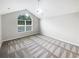 Bedroom with a vaulted ceiling and a large window, providing ample natural light at 2252 Carefree Cir # 3, Marietta, GA 30062