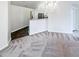 Open dining area with chandelier and view into the kitchen and living room at 2252 Carefree Cir # 3, Marietta, GA 30062