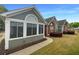 Charming home exterior with a screened-in porch, brick accents, and well-kept landscaping at 2252 Carefree Cir # 3, Marietta, GA 30062