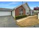 Charming single-story home with a brick facade, attached garage, and a well-manicured lawn at 2252 Carefree Cir # 3, Marietta, GA 30062