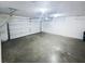 Spacious garage with a clean, concrete floor and an automatic door with an electric opener at 2252 Carefree Cir # 3, Marietta, GA 30062