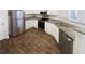 Modern kitchen with stainless steel appliances, granite countertops, and wood-look flooring at 2252 Carefree Cir # 3, Marietta, GA 30062