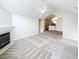 Open living area with fireplace, vaulted ceiling, and view of the kitchen bar at 2252 Carefree Cir # 3, Marietta, GA 30062