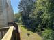 View from deck looking out on a private backyard with mature trees at 2939 Stonecrest Ln, Lithonia, GA 30038