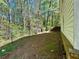 The backyard features a partial fence and easy access to the woods at 2939 Stonecrest Ln, Lithonia, GA 30038
