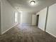 Spacious bedroom featuring neutral carpet, grey walls, and a standard closet at 2939 Stonecrest Ln, Lithonia, GA 30038