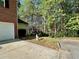 Side yard with a view of the forest at 2939 Stonecrest Ln, Lithonia, GA 30038