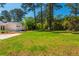 Expansive green backyard featuring mature trees and ample space for outdoor activities and entertaining at 3365 Ardley Sw Rd, Atlanta, GA 30311