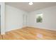 Cozy bedroom with hardwood floors, soft lighting, and a closet, offering a comfortable and relaxing space at 3365 Ardley Sw Rd, Atlanta, GA 30311