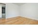 The bedroom features hardwood floors, fresh white walls, and a door to an on-suite bathroom at 3365 Ardley Sw Rd, Atlanta, GA 30311