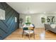 Elegant dining room with a modern accent wall, stylish lighting, and comfortable seating at 3365 Ardley Sw Rd, Atlanta, GA 30311
