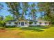 Charming, single-story home features a well-manicured lawn, classic brick exterior, and mature trees at 3365 Ardley Sw Rd, Atlanta, GA 30311