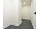 The hallway has modern flooring and white walls, creating a sleek and clean look, leading to other rooms at 3365 Ardley Sw Rd, Atlanta, GA 30311