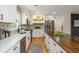 Well-appointed kitchen featuring stainless appliances, wooden countertops and stylish backsplash tiling at 3365 Ardley Sw Rd, Atlanta, GA 30311