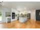 Bright, open kitchen with white cabinets, stainless appliances, and a large center island with seating at 3365 Ardley Sw Rd, Atlanta, GA 30311