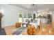 Cozy living room featuring shiplap walls, hardwood floors, and access to the backyard at 3365 Ardley Sw Rd, Atlanta, GA 30311