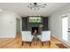 Inviting living room features a painted brick fireplace, modern decor, and plenty of natural light at 3365 Ardley Sw Rd, Atlanta, GA 30311