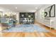 Open-concept living room featuring a modern decor with a large area rug and hardwood floors at 3365 Ardley Sw Rd, Atlanta, GA 30311