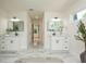 Bright main bathroom featuring dual sinks, modern fixtures, and stylish marble flooring at 3365 Ardley Sw Rd, Atlanta, GA 30311