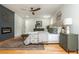 Spacious main bedroom with hardwood floors, stylish accents, a fireplace and sliding barn doors at 3365 Ardley Sw Rd, Atlanta, GA 30311