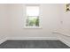 Bright room with new gray floors and a view from the window at 3365 Ardley Sw Rd, Atlanta, GA 30311
