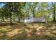 View of the backyard with a house and a shed, offering both living and storage space at 4301 Hidden Valley Rd, Decatur, GA 30035