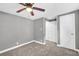 Gray painted bedroom with a ceiling fan and a pass-through to another room at 4301 Hidden Valley Rd, Decatur, GA 30035