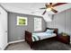 Cozy bedroom features a small bed with a matching nightstand and two windows at 4301 Hidden Valley Rd, Decatur, GA 30035