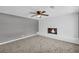 Relax in the living room, featuring a fireplace and ceiling fan at 4301 Hidden Valley Rd, Decatur, GA 30035