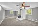 Spacious living room with windows, ceiling fan, and wood burning stove at 4301 Hidden Valley Rd, Decatur, GA 30035