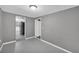 Small room painted gray provides pass-through to kitchen at 4301 Hidden Valley Rd, Decatur, GA 30035