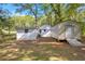 Exterior view of a home with a shed, offering plenty of space for storage and projects at 4301 Hidden Valley Rd, Decatur, GA 30035