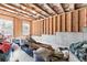 Unfinished basement with exposed ceiling, framing, and windows offers potential for customization at 4466 Woodland Bank Blvd, Buford, GA 30518