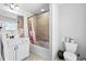 Bathroom with white vanity, tub/shower, and tile surround at 4466 Woodland Bank Blvd, Buford, GA 30518