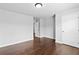 A light and bright bedroom with hardwood floors and a large window at 4466 Woodland Bank Blvd, Buford, GA 30518
