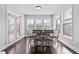 Bright dining area with large windows and a glass door allowing ample natural light at 4466 Woodland Bank Blvd, Buford, GA 30518