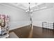 Dining area featuring stylish chandelier, ample lighting, and hardwood flooring at 4466 Woodland Bank Blvd, Buford, GA 30518
