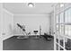 Exercise room featuring rubber flooring, ceiling trim and large windows at 4466 Woodland Bank Blvd, Buford, GA 30518