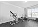 Bright exercise room featuring rubber flooring, ceiling trim and large windows at 4466 Woodland Bank Blvd, Buford, GA 30518