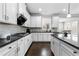 Large kitchen with white cabinets, an island, and stainless steel appliances at 4466 Woodland Bank Blvd, Buford, GA 30518