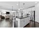 Spacious kitchen with large island, stainless steel appliances, and open to living area at 4466 Woodland Bank Blvd, Buford, GA 30518