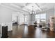 Office featuring hardwood floors, crown molding, and a large window at 4466 Woodland Bank Blvd, Buford, GA 30518