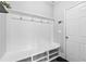 Mudroom with a bench, hooks, and storage cubbies by the door at 4466 Woodland Bank Blvd, Buford, GA 30518