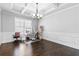 Office featuring hardwood floors, crown molding, and a large window at 4466 Woodland Bank Blvd, Buford, GA 30518