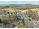 Aerial view of a residential neighborhood with mature trees and well-maintained homes at 5381 Fawn Meadow Ln, Powder Springs, GA 30127