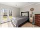Bedroom with tiled floors and French doors that let in plenty of natural light at 5381 Fawn Meadow Ln, Powder Springs, GA 30127