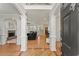 An open foyer leads to the living area, showcasing hardwood floors and elegant columns at 5381 Fawn Meadow Ln, Powder Springs, GA 30127