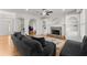 Bright living room with hardwood floors, fireplace, and views to the foyer at 5381 Fawn Meadow Ln, Powder Springs, GA 30127