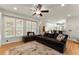Living room with hardwood floors, large windows, and an open floor plan at 5381 Fawn Meadow Ln, Powder Springs, GA 30127